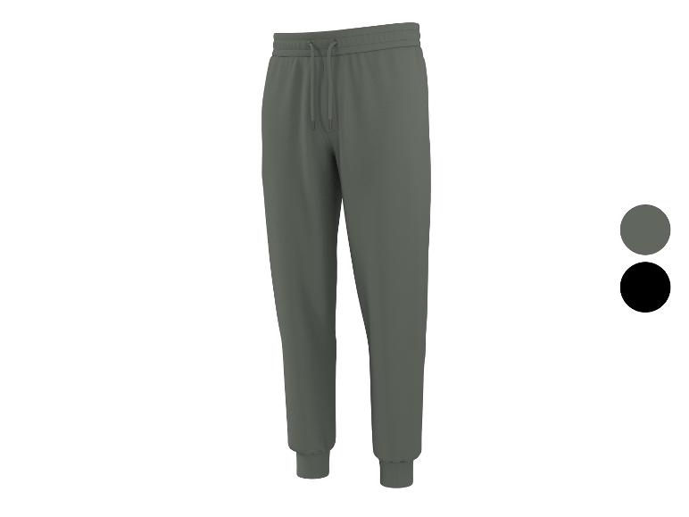 Grijze joggingbroek met trekkoord en boorden, met grijze en zwarte kleurstalen.