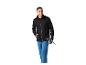 Man in zwart jack en blauwe broek met wandelstokken.