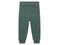 Groene joggingbroek voor kinderen.