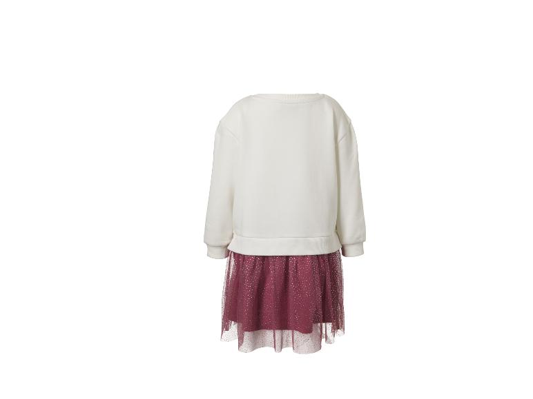 Witte sweaterjurk met bordeauxrode tule rok met glimmende stippen.
