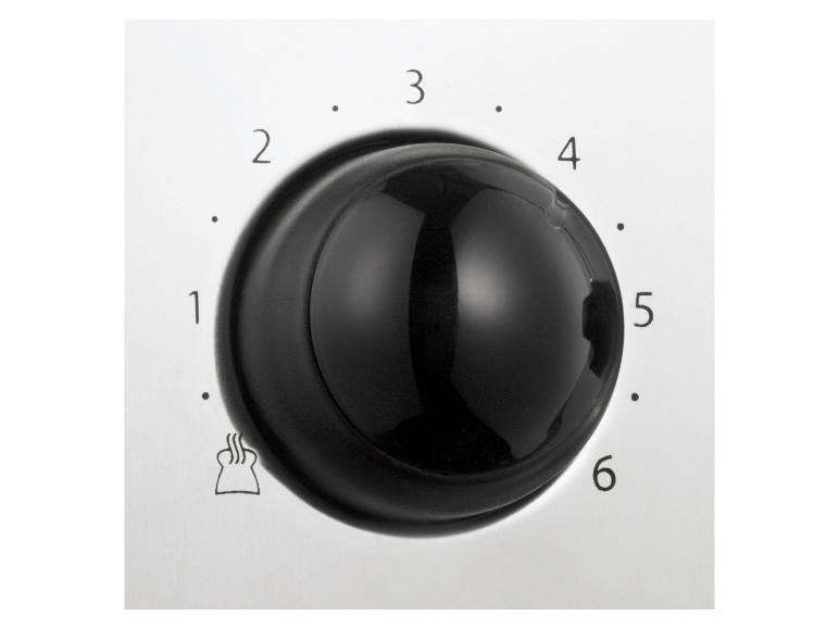 Een close-up van een draaiknop met nummers 1 tot en met 6, waarschijnlijk voor een broodrooster.