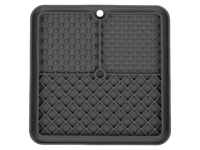 Grijze siliconen mat met verschillende texturen.