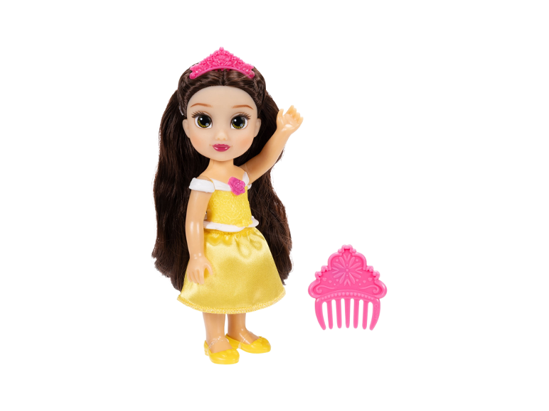 Prinsessenpop in gele jurk met roze tiara, vergezeld van een roze kam.