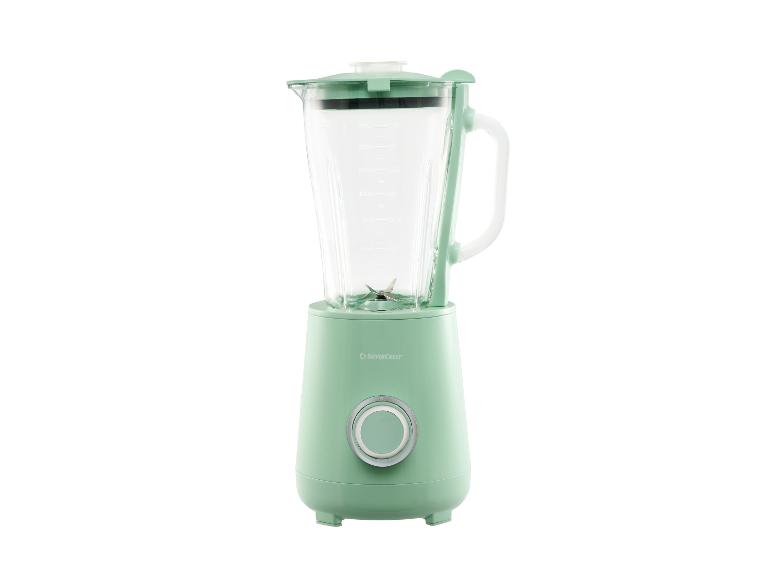 Lichtgroene blender met glazen kan en zilveren knop.