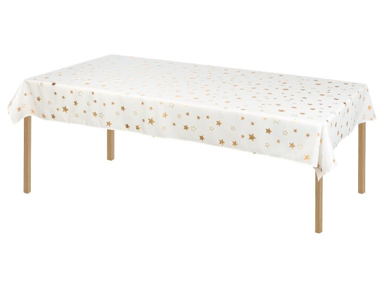 Een witte tafelkleed met gouden sterren.