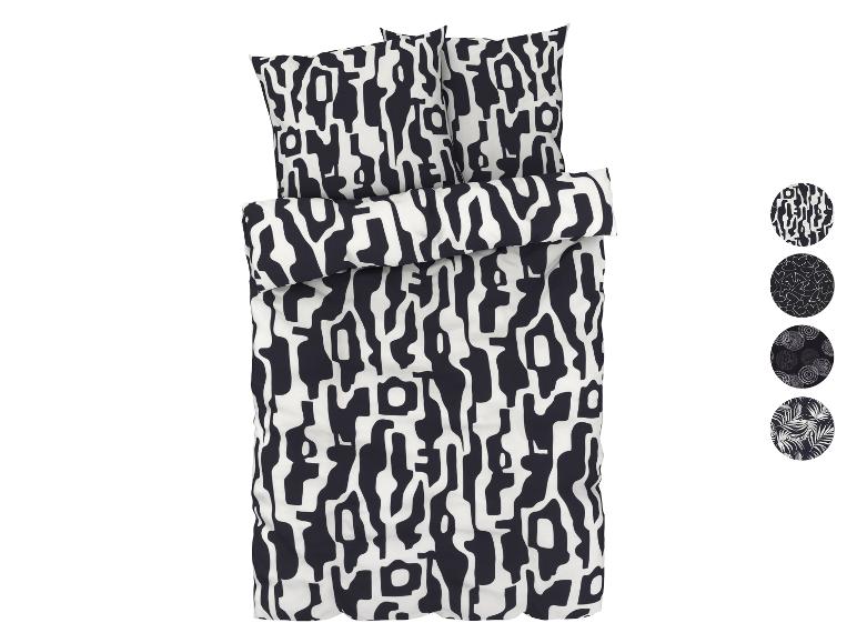 Een zwarte en witte dekbedovertrek met abstract patroon.