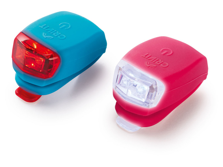 Twee Grit-fietslampjes, een rood en een wit.