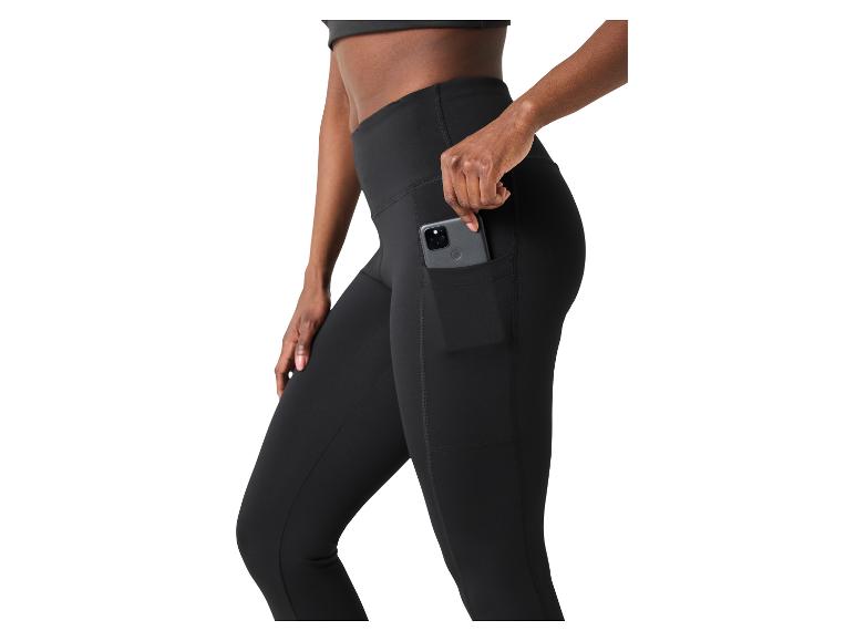 Zwarte sportlegging met zijzak waarin een smartphone zit