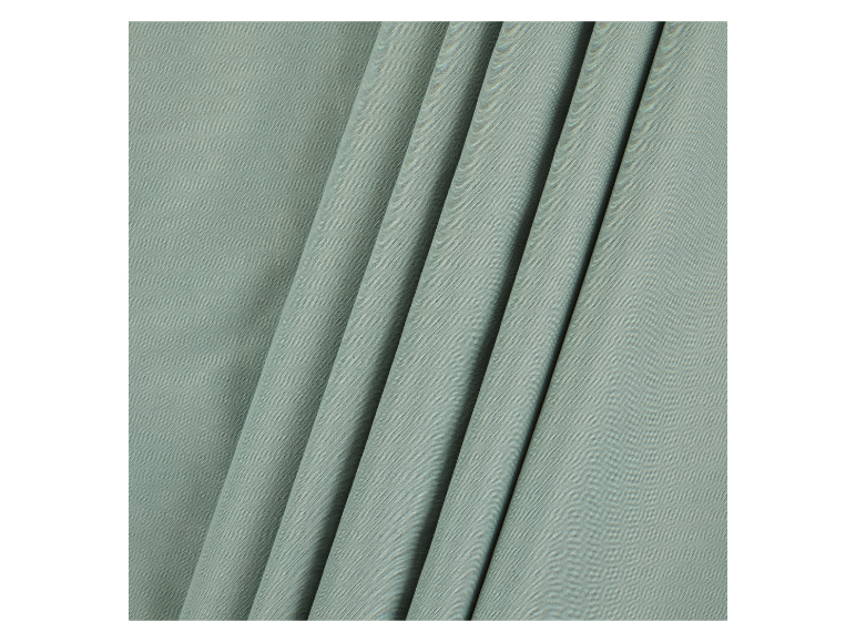 Zachte, lichtgroene stof met fijne textuur.