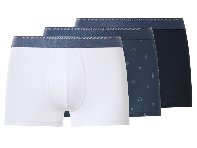 Set van 3 herenboxers: wit, marineblauw met zeilbootpatroon en effen marineblauw.
