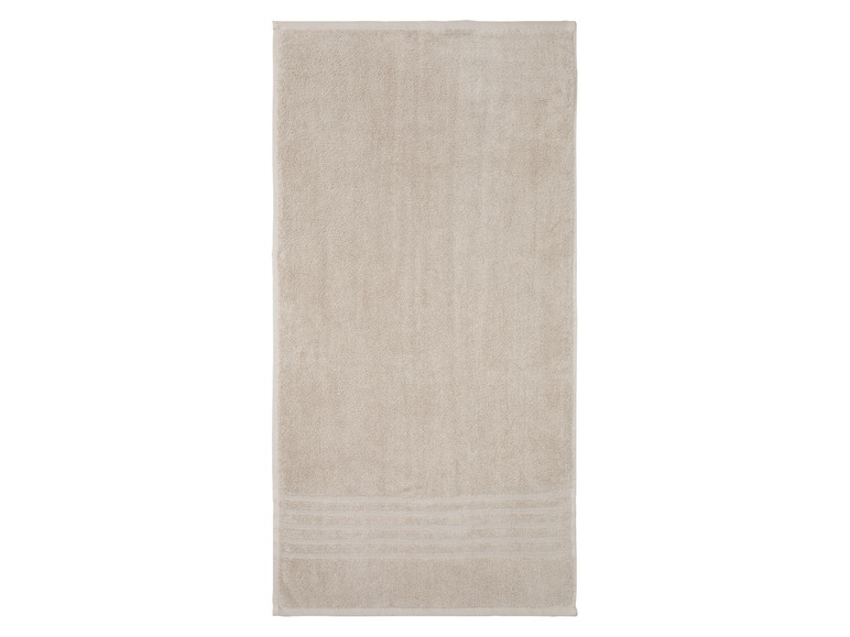 Beige badhanddoek met geborduurde strepen.