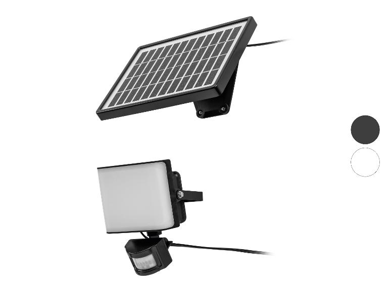 Op zonne-energie werkende LED-schijnwerper met bewegingssensor, verkrijgbaar in zwart en wit.