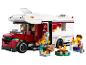 LEGO City set met camper, minifiguren en kampvuur.