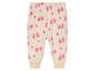 Witte joggingbroek met roze print van bomen en harten.