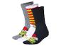 Drie paar Grinch-sokken met kerstthema in grijs, wit en zwart
