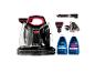 Bissell Multiclean Spot & Stain reiniger met accessoires en twee flessen schoonmaakmiddel.