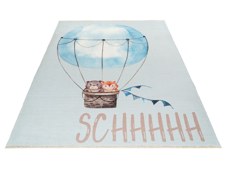 Een blauwe vloerkleed met een luchtballon, dieren en de tekst 'SCHHHH'