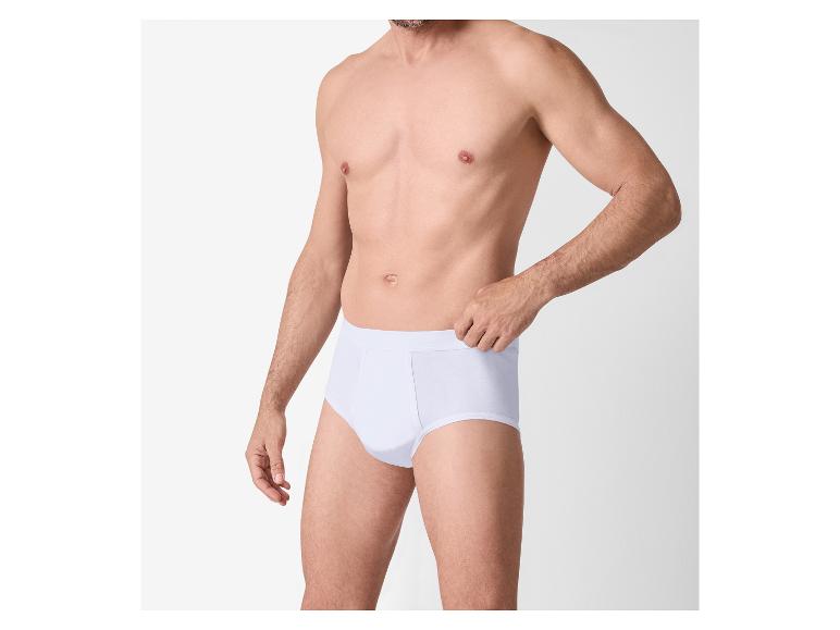 Man in witte slip tegen een witte achtergrond.