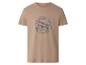Beige T-shirt met een grijs vliegtuigmotief en de tekst 'ADVENTURE TIME BORN TO FLY'.
