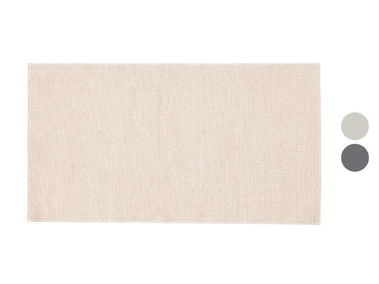 Beige getextureerd rechthoekig vloerkleed, met lichtgrijze en donkergrijze kleurstalen.