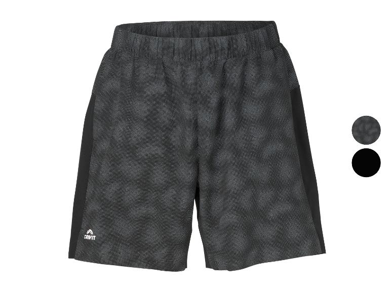 Donkergrijze sportshorts met een subtiel patroon en zwarte zijpanelen.