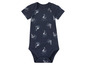 Een donkerblauwe baby romper met witte bootjes en golven