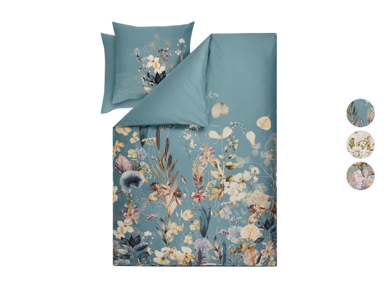 Dekbedovertrek met bloemenpatroon in blauwe en beige tinten, met extra ontwerpen.