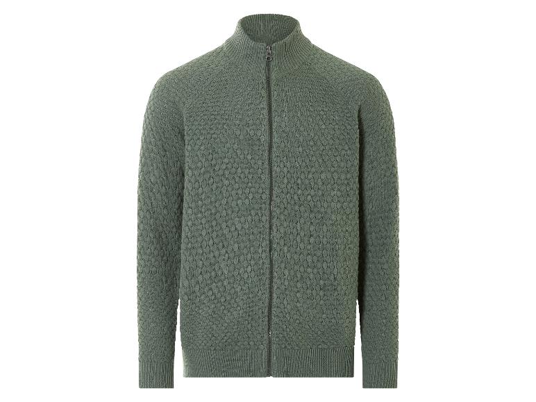 Een groene gebreide trui met rits.