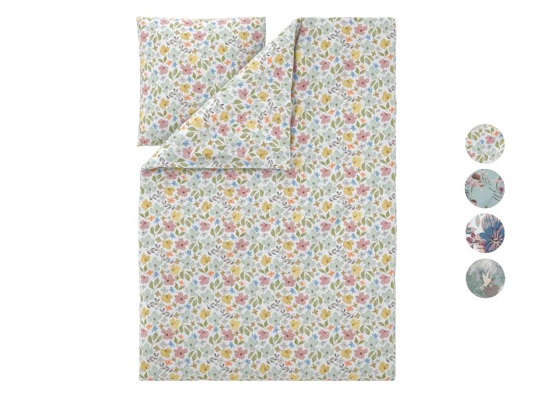 Bloemrijk dekbedovertrekset met kussensloop, met pastelkleurige bloemen en bladeren.