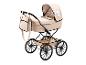 Beige poppenwagen met zwart frame en wielen, met bijpassende tas.