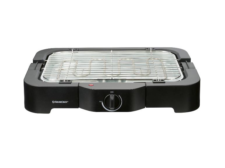 Zwarte elektrische grill met metalen rooster en temperatuurregelaar