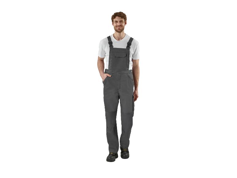 Man in grijze overall en wit T-shirt
