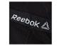 Zwarte elastische band met wit en grijs Reebok-logo op compressieshorts.