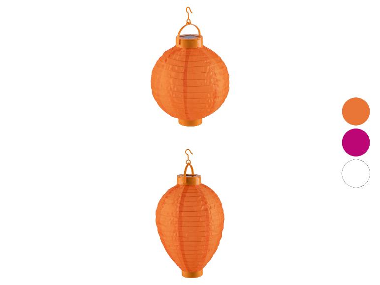 Twee oranje zonnelantaarns, één rond, één ovaal, met een kleurenpalet.