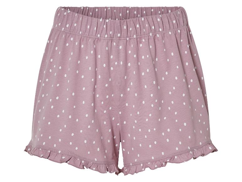 Roze pyjama shorts met witte stippen.
