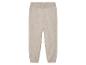Beige gebreide broek met een elastische tailleband.