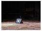 LIVARNO® werklamp »The Portable« verlicht een donkere ruimte.