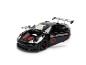 Zwart sportwagenmodel met open deuren en motorkap, rode accenten en een Star Wars-logo.