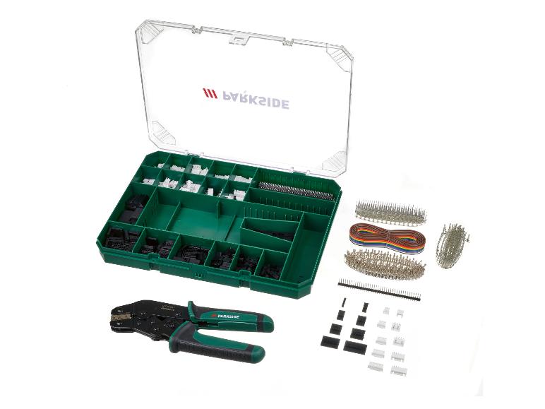Een set met Parkside krimptang, connectoren en draden in een groene opbergdoos.