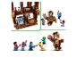 Lego Minecraft set met bruin huis, minifiguren en een grote piglin-figuur.