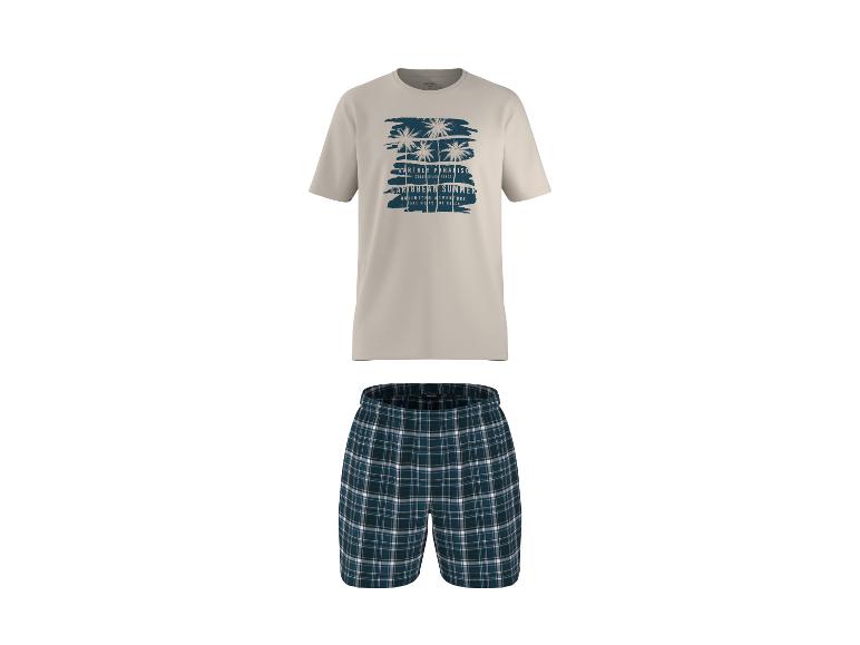 Herenpyjama: beige T-shirt met palmbomenprint en geruite shorts.