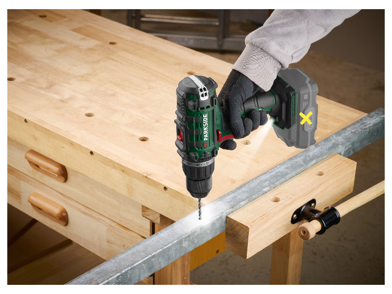 Een Parkside accu-boormachine boort in een metalen balk op een werkbank.