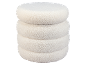 Ronde witte bouclé poef met gelaagd ontwerp.