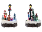 LIVARNO home LED-kerstdorpfiguren met verlichte lantaarnpalen en feestelijke taferelen.