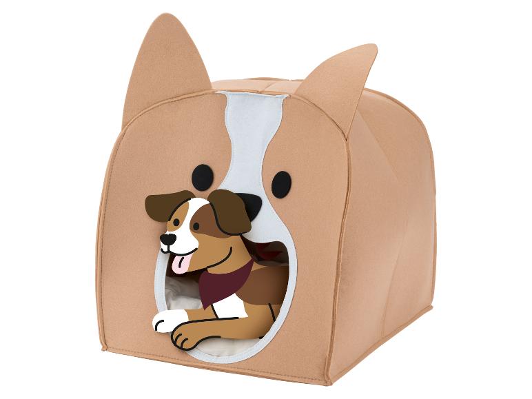 Hondenhok in de vorm van een corgi met een cartoonhond die eruit gluurt.