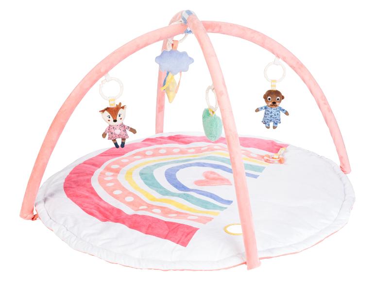 Een roze babygym met een regenboogmat, een eekhoorn en een bever speelgoed.