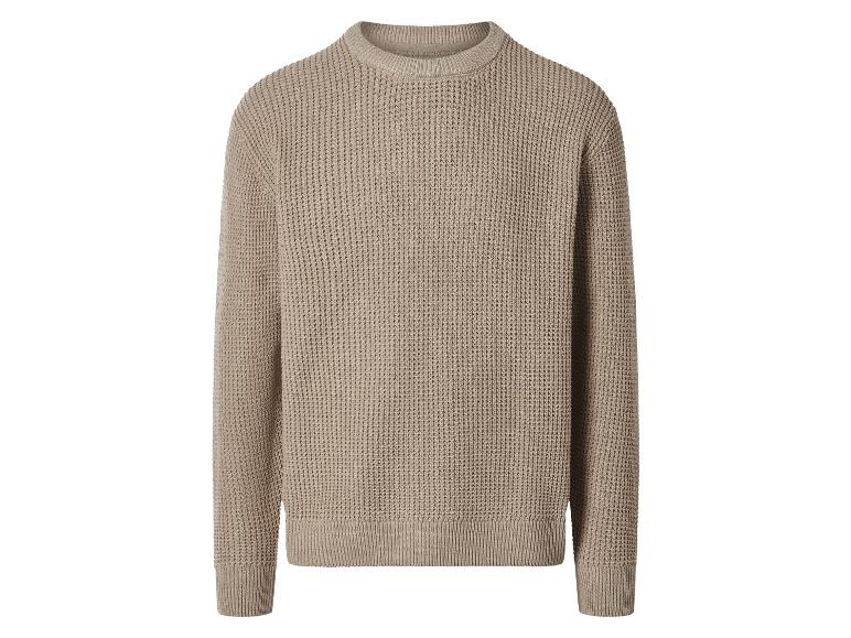 Beige gebreide trui met wafelpatroon.