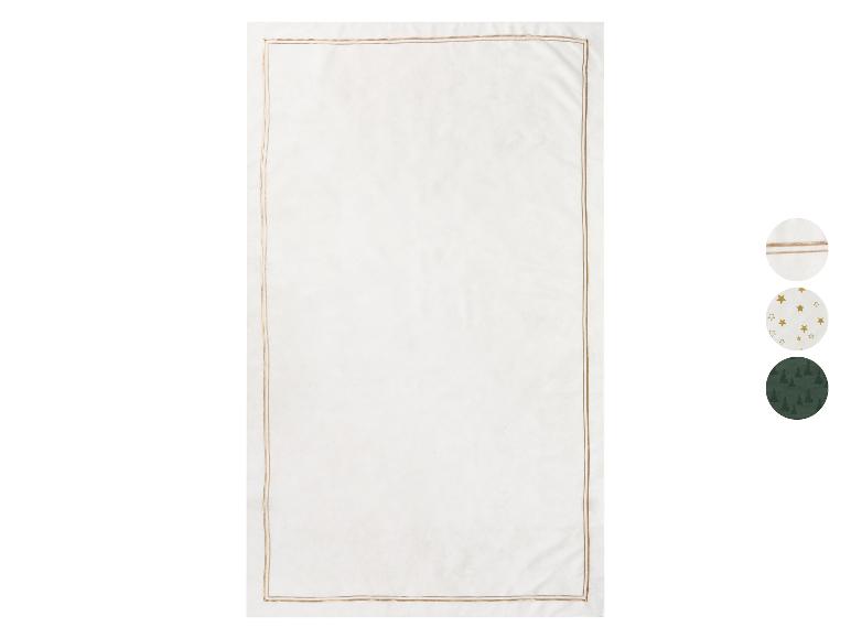 Witte tafellaken met een gouden rand en verschillende patronen.