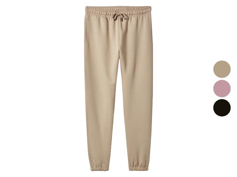 Beige joggingbroek met trekkoord, met roze en zwarte kleuropties.