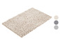 Beige badmat met een zachte, pluche textuur.